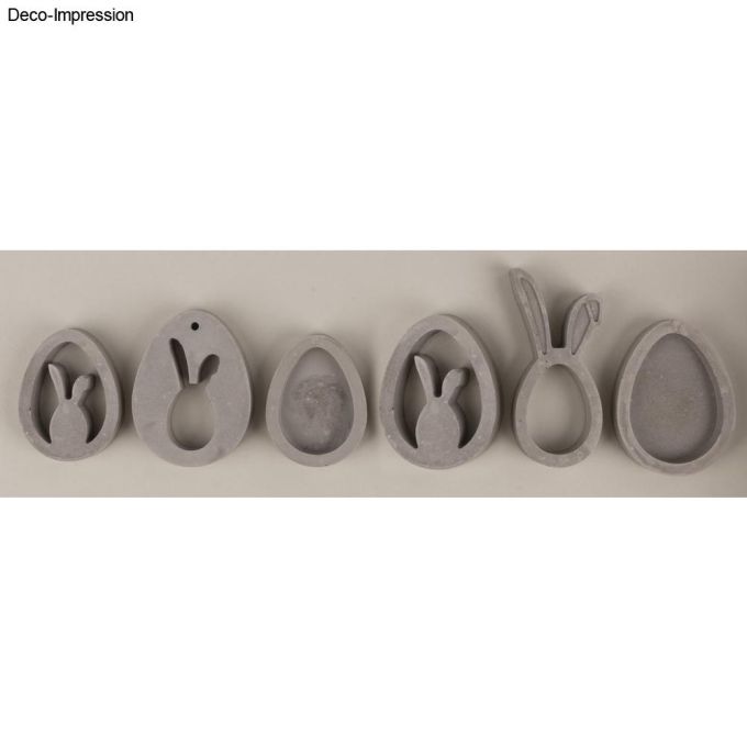 Osteranhänger aus der Silikon-Gießform von Easy-Sticks, präsentiert in Kombination mit natürlichen Materialien für eine ansprechende Deko.