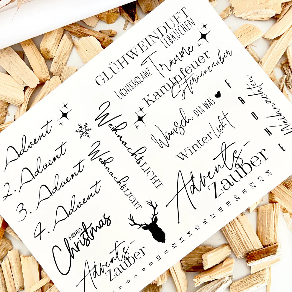 Kerzentattoo A5 Wasserschiebefolie Weihnachten von easy-sticks, präsentiert auf einem DIN A5 Bogen mit festlichen Motiven und Sprüchen für eine besondere Weihnachtsdekoration.