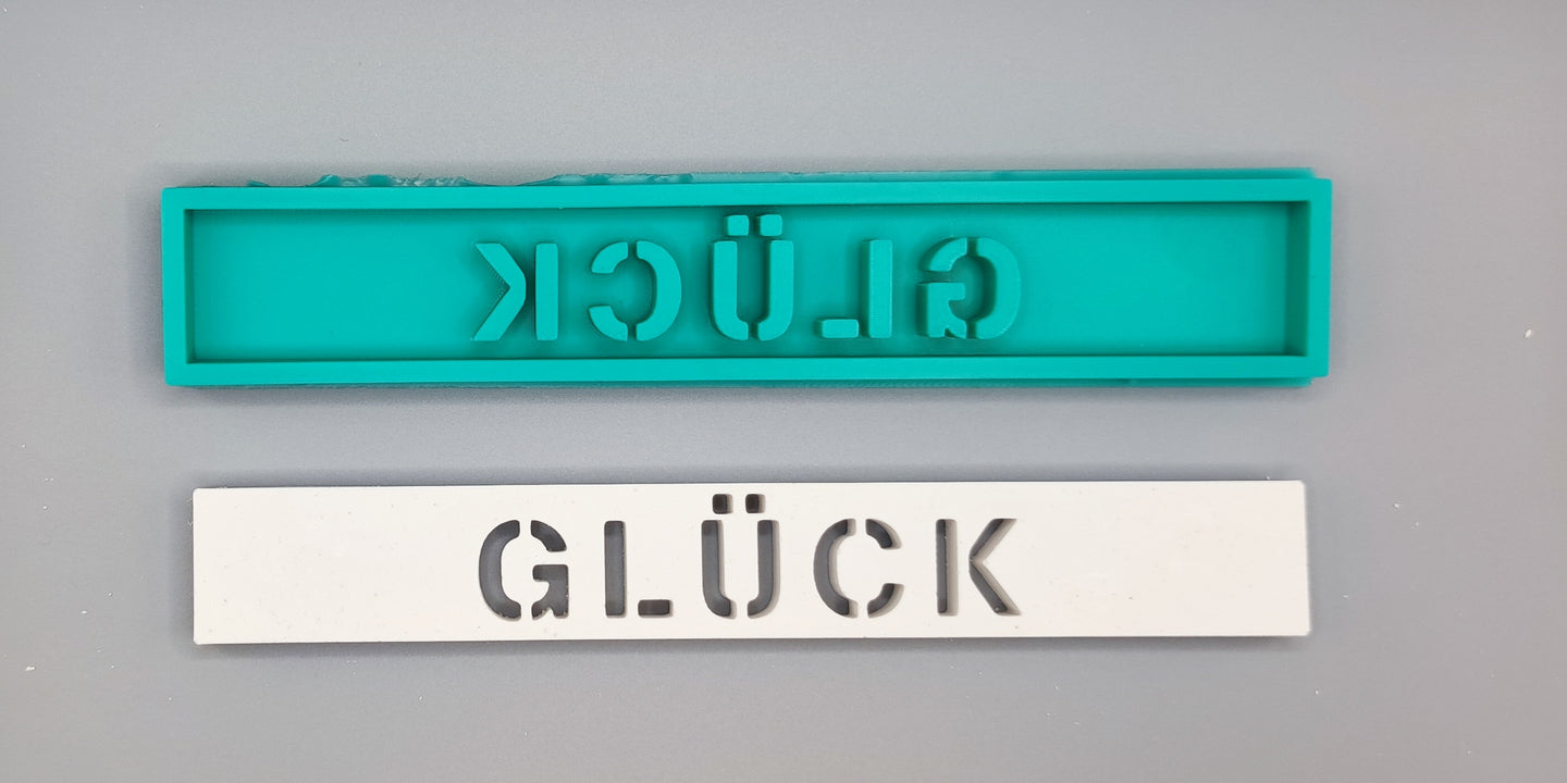 Professionelle Easy-Sticks Silikonform mit dem Schriftzug 'Glück', perfekt für individuelle Deko und Geschenke, hergestellt aus hochwertigem Silikon in Deutschland.
