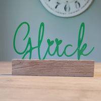 Schöner Acryl Aufsteller von Easy-Sticks mit dem Wort 'Glück' in leuchtendem Grün, ein ideales Accessoire für eine inspirierende Inneneinrichtung.