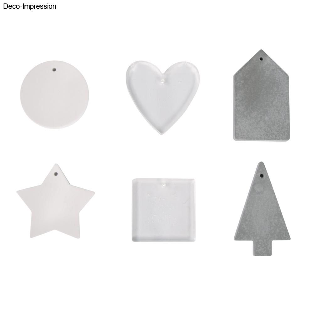 Fertige Deko-Anhänger aus der Silikonform von easy-sticks: Herz, Stern und Baum aus transparentem Gießharz für kreative Bastelprojekte.