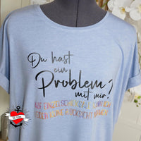 Stylisches T-Shirt mit dem Spruch 'Du hast ein Problem mit mir? Auf Einzelschicksale kann ich leider keine Rücksicht nehmen' von easy-sticks, ideal für Modeschöpfer.