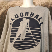 Lade das Bild in den Galerie-Viewer, Grau meliertes T-Shirt mit Floorball Silhouette, erstellt von easy-sticks, perfekt für Sportliebhaber und kreative Projekte.
