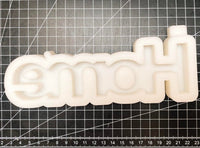 Silikonform von Easy-Sticks mit dem Wort 'Home', auf einem matten Hintergrund, ideal für DIY-Dekorationsideen.