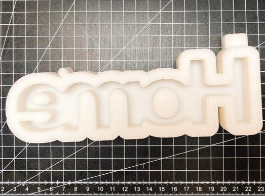 Silikonform von Easy-Sticks mit dem Wort 'Home', auf einem matten Hintergrund, ideal für DIY-Dekorationsideen.