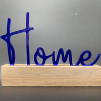 Stylischer Easy-Sticks Acryl Aufsteller in transparentem Design mit 'Home' Schriftzug, perfekt als Geschenk oder Wohnaccessoire.