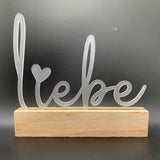 Transparenter Acryl Aufsteller "Liebe" von Easy-Sticks, stilvoll auf Holz basierend, perfekt als Geschenk oder Dekoration für besondere Anlässe.