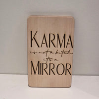 Karma is not a bitch it´s a mirror geplottet, gelasert auf einem Brett