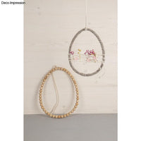 Zwei Metallringe in Ei-Form von easy-sticks, einer dekoriert mit Trockenblumen, perfekt für Frühling und Ostern.
