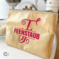 Schöne goldene Kosmetiktasche mit monogrammlicher "F" Plotterdatei von easy-sticks, perfekt für kreative DIY-Projekte.