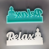 Zwei Silikonformen in mintgrün und weiß von Easy-Sticks, beide mit dem Schriftzug 'Relax' und einer Buddha-Illustration - Kreatives Bastelmaterial