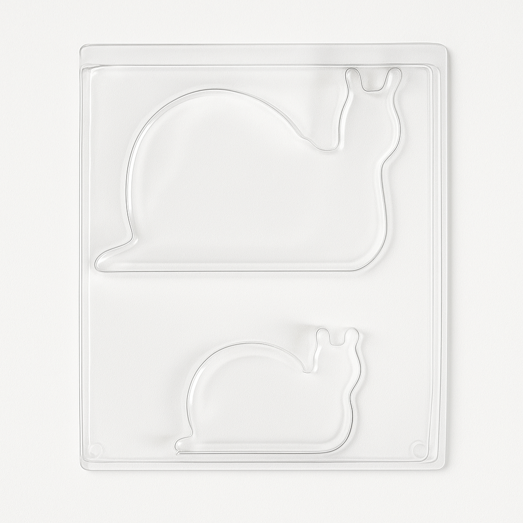 Transparente Gießform von Easy-Sticks, die die Form von zwei Schnecken in verschiedenen Größen zeigt. Ideal für kreative Bastelprojekte und die Herstellung eigener Kunstwerke.
