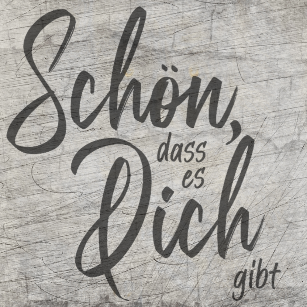 Elegant gestaltete Schrift mit dem Text "Schön, dass es dich gibt" auf rustikalem Holz hintergrund, ideal für kreative Projekte mit der Plotterdatei von easy-sticks.
