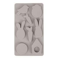 Detailaufnahme der Silikonform 'Happy Spring' von Easy-Sticks mit verschiedenen Formen wie Hase, Vogel, und Karotten, geeignet für kreative Bastelideen.