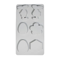 Silikonform - Osterfreunde von Easy-Sticks, klare Darstellung der Motive wie Hasen und Eier auf einem weißen Hintergrund.