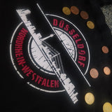 Schwarze Tragetasche mit dem Druck "Düsseldorf Nordrhein-Westfalen" und Skyline, hergestellt mithilfe der Stempel Skyline Düsseldorf Plotterdatei von easy-sticks.