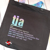 Schicke schwarze Tragetasche mit dem Schriftzug 'tja' in schimmernden Farben von easy-sticks, ideal für kreative Projekte.