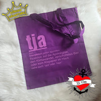 Lila Stofftasche mit dem Wort 'tja', entworfen von easy-sticks, ideal für kreative Unternehmungen und alltägliche Produkte.