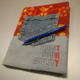 Notizbuch mit einem bunten Design und der Aufschrift 'TRUST YOUR ABILITY' von easy-sticks, ideal für kreative Bastelprojekte.