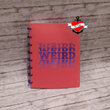 Notizbuch in leuchtendem Rot mit dem auffälligen "Weird" Logo von B. Style, das Kreativität inspiriert.