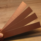 Vier kupferfarbene Easy-Sticks in der Hand gehalten, perfekt für vielseitige Bastelideen von Easy-Sticks.