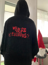 Eine moderne schwarze Kapuzenjacke mit dem Aufdruck "Why so serious?" in roter Schrift, designt von easy-sticks für einzigartige Designs.