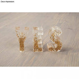 Transparente Buchstaben mit Glitzerfüllung, die mit einer Silikonform von Easy-Sticks hergestellt wurden - Silikonform - Buchstaben.