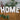 Personalisierte Buchstaben aus Kunstharz von easy-sticks, die das Wort 'HOME' darstellen, umgeben von Eukalyptuszweigen. Ideal für kreative Wohnkultur und personalisierte Geschenkideen.