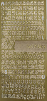 Goldene Buchstabenaufkleber "Buchstaben groß" von easy-sticks, auf goldenem Hintergrund arrangiert, perfekt für individuelle Beschriftungen.